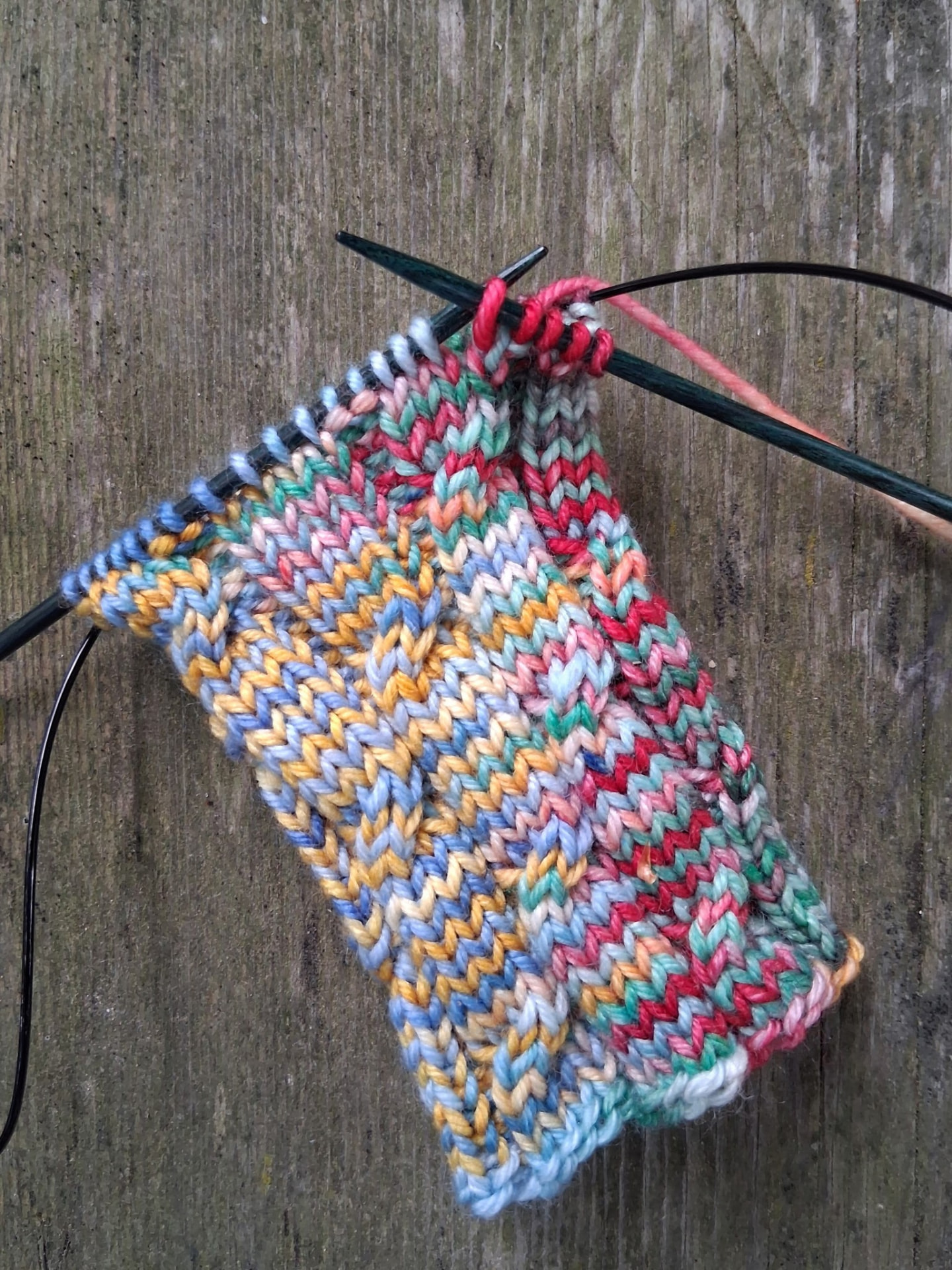 A colourful sock in progress on circular needles