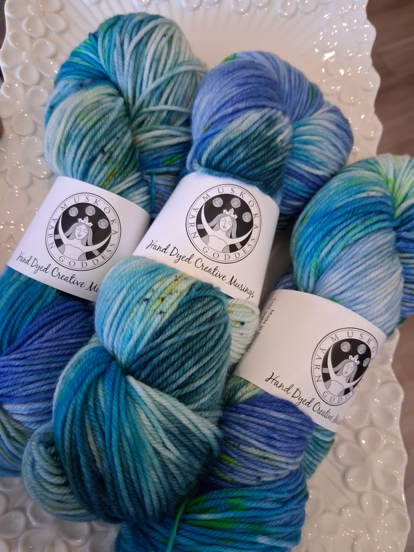 Hand-dyed Muskoka Yarn Connection sock yarn in lake blues and greens